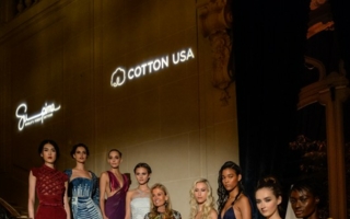 US ambassador Jane Hartley, hosting the Paris Supima/Cotton USA fashion show, surrounded by models in haute couture gowns made from the finest US c...
