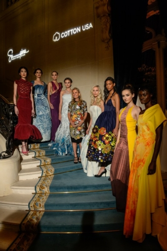 US ambassador Jane Hartley, hosting the Paris Supima/Cotton USA fashion show, surrounded by models in haute couture gowns made from the finest US c...